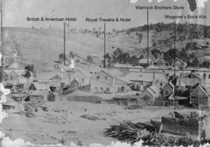 Left frame of panorama showing the British & American Hotel, rear of Royal Hotel and Theatre, Warnock Bros' Store and Wagener's brick kiln.